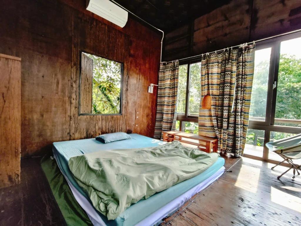 Ένα ή περισσότερα κρεβάτια σε δωμάτιο στο Le Home
