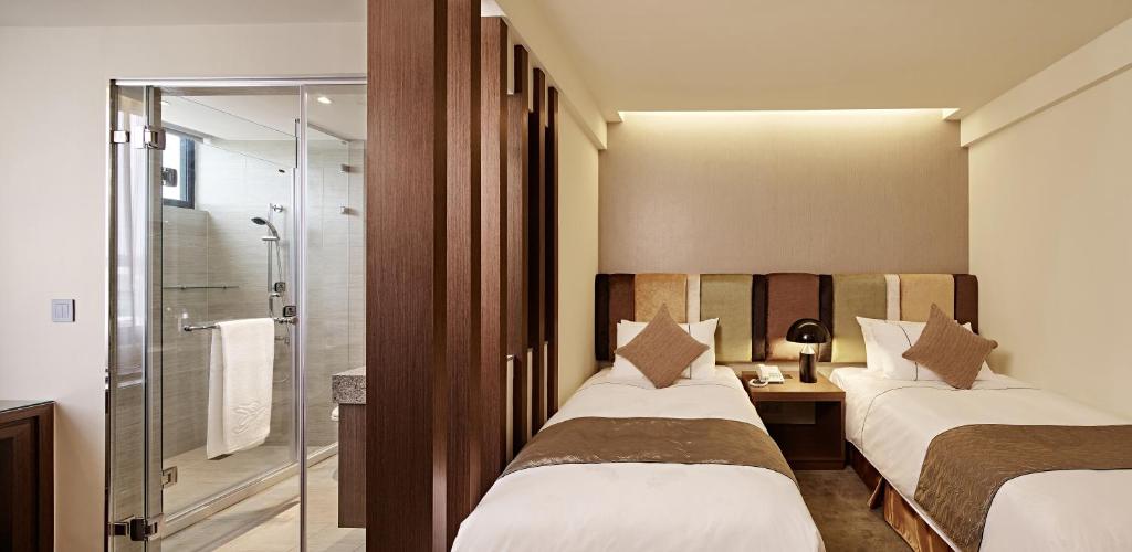 Postel nebo postele na pokoji v ubytování Hotel Sukimi