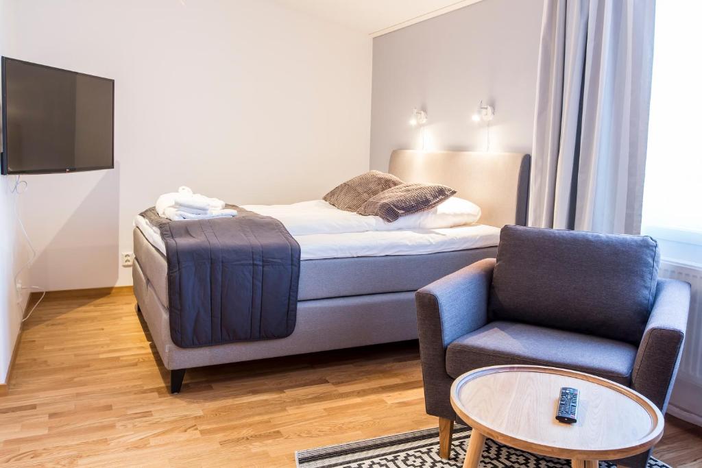 Postel nebo postele na pokoji v ubytování Simloc Hotel Drottninggatan