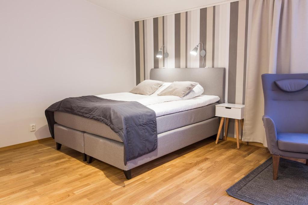 Postel nebo postele na pokoji v ubytování Simloc Hotel Drottninggatan
