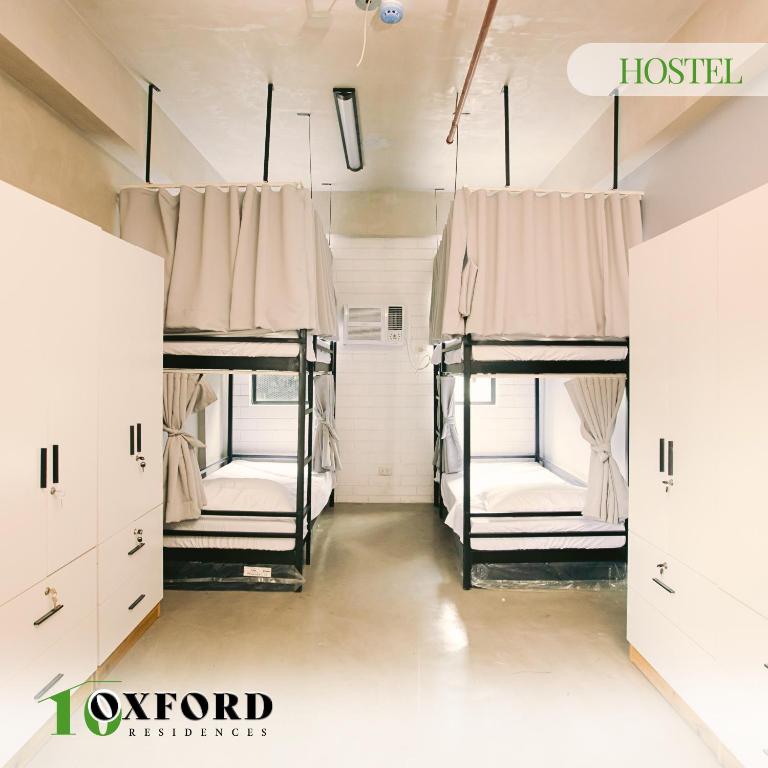 Postel nebo postele na pokoji v ubytování 10 Oxford Residences