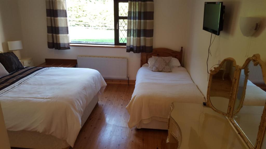 Postel nebo postele na pokoji v ubytování Ely House B&B