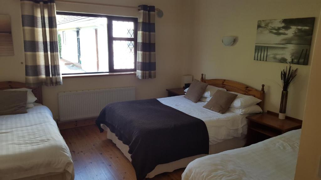 Postel nebo postele na pokoji v ubytování Ely House B&B