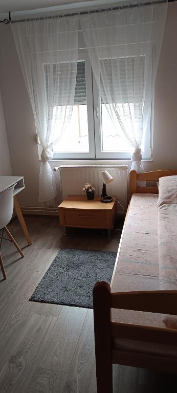 Postel nebo postele na pokoji v ubytování ARIANA apartman