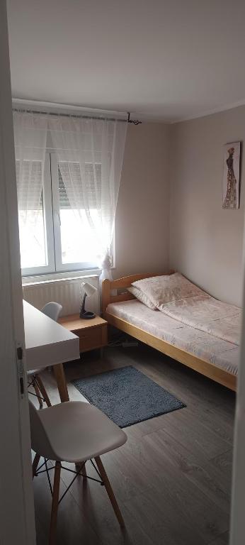 Postel nebo postele na pokoji v ubytování ARIANA apartman