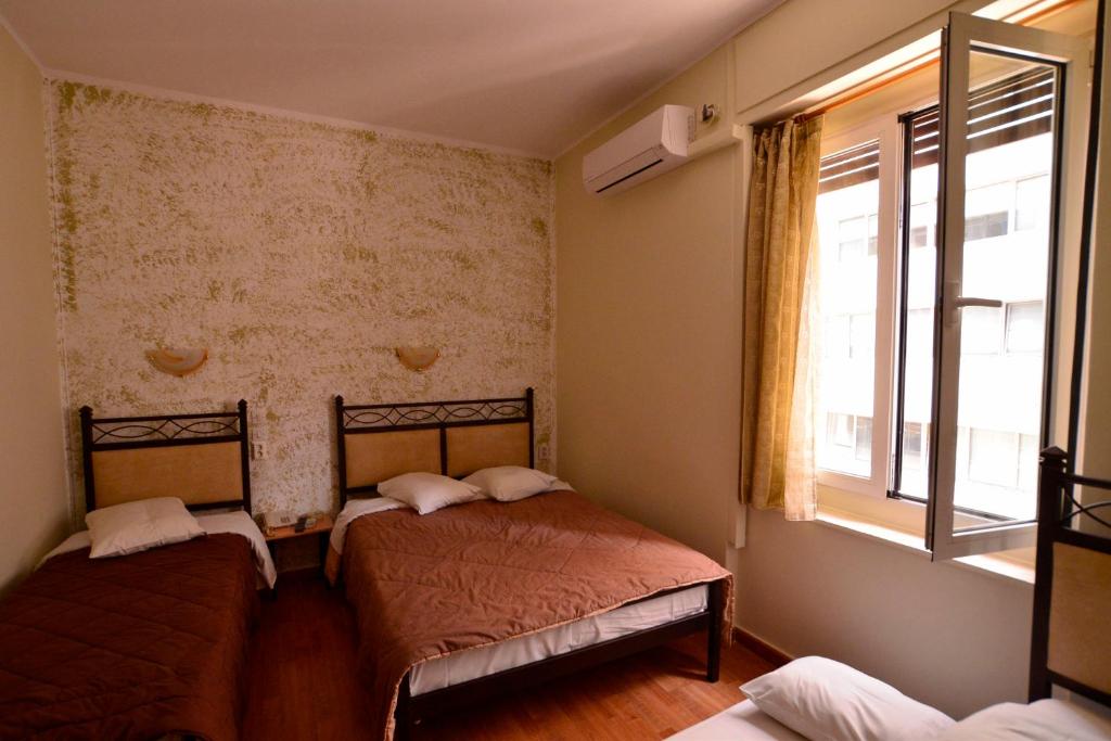 Postel nebo postele na pokoji v ubytování Electra Hotel Piraeus