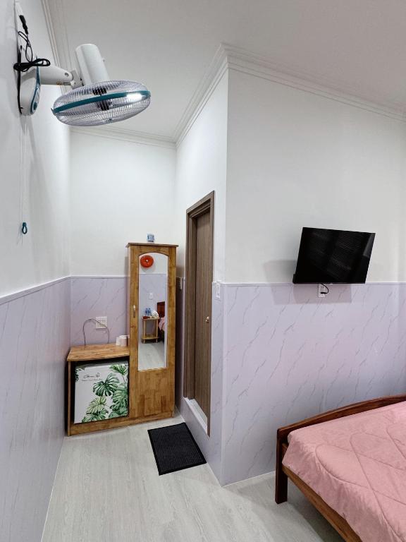 Giường trong phòng chung tại Nhà Nghỉ Phố Biển Phan Thiết