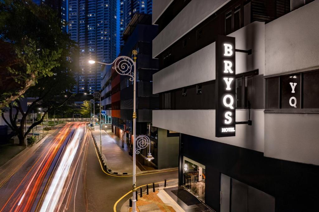 a hotel sign on the side of a building at BRYQS Hotel KL Sentral in Kuala Lumpur