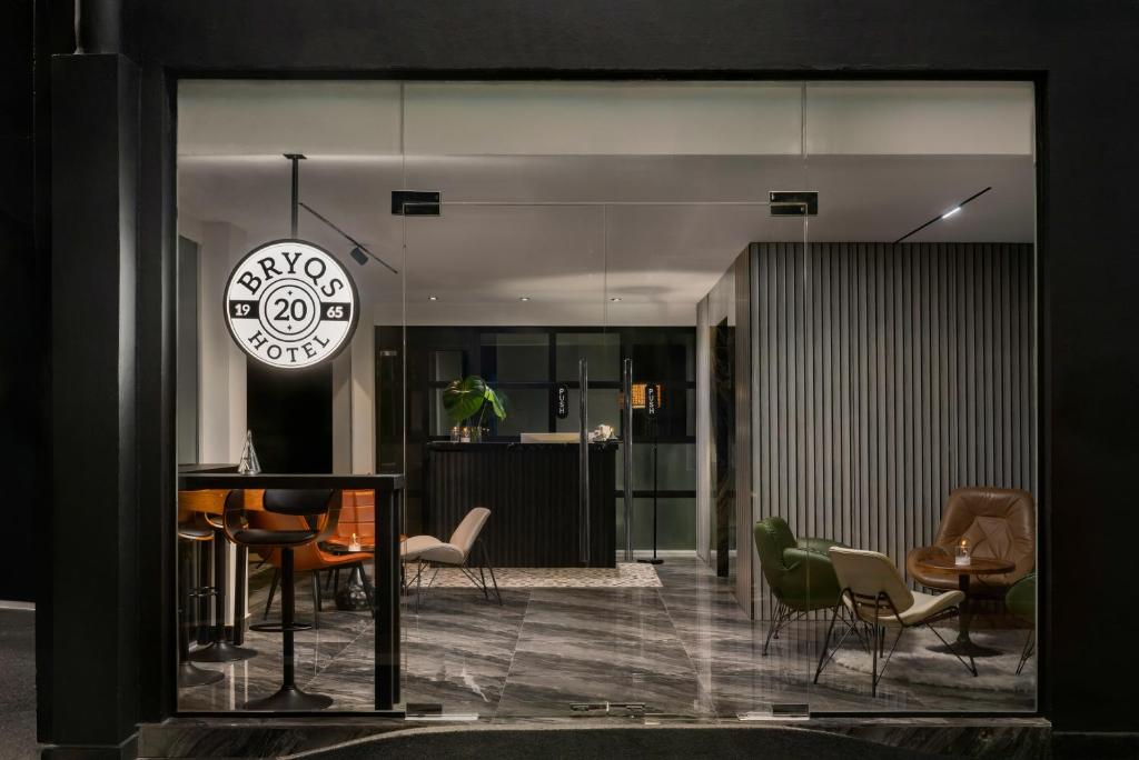 a living room with a table and chairs at BRYQS Hotel KL Sentral in Kuala Lumpur
