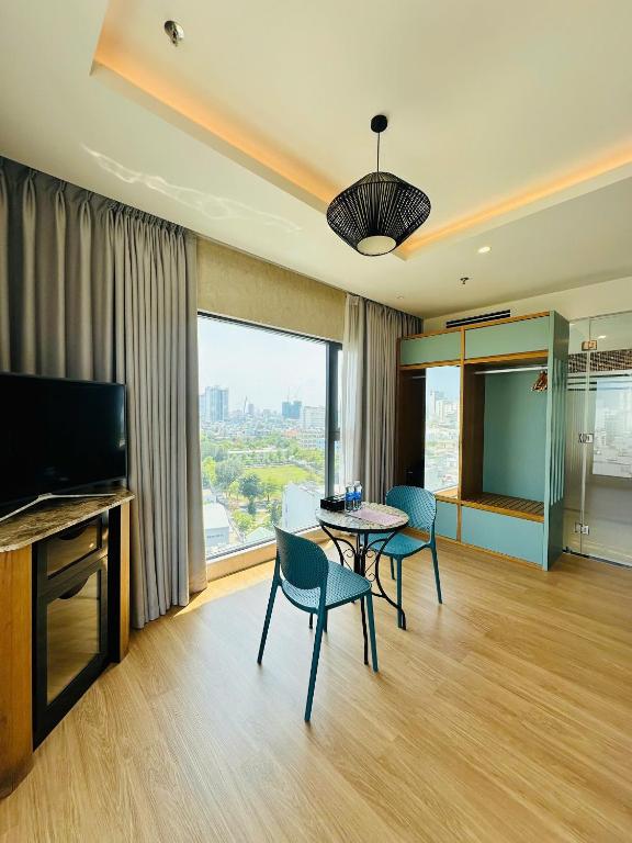 TV a/nebo společenská místnost v ubytování NAM Hotel & Residences
