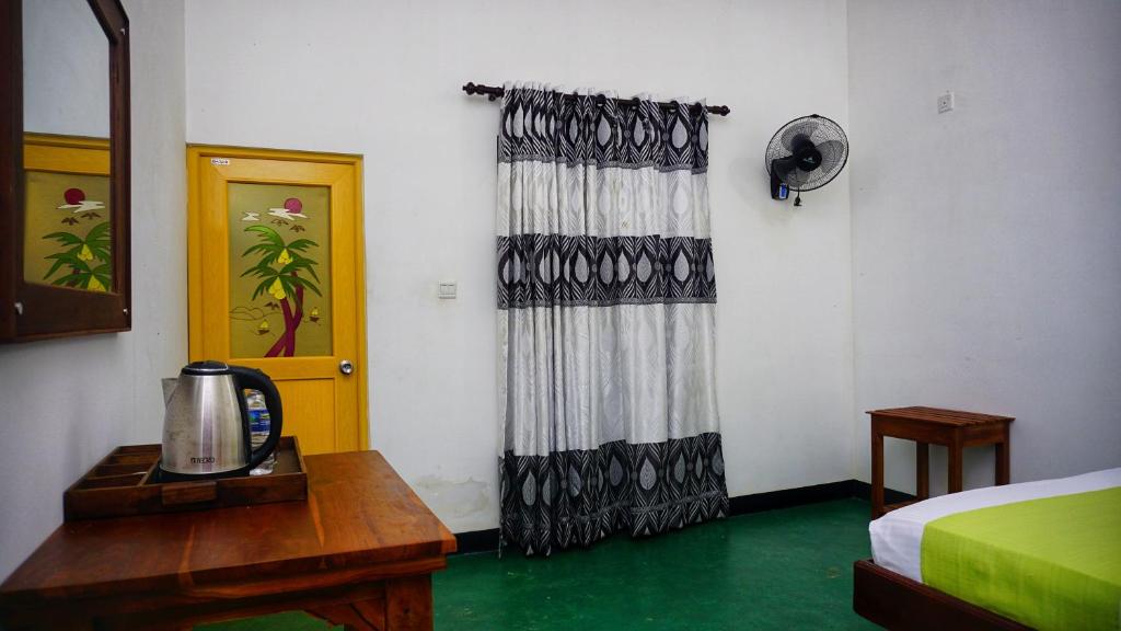 Postel nebo postele na pokoji v ubytování Sigiriya Royal Resort