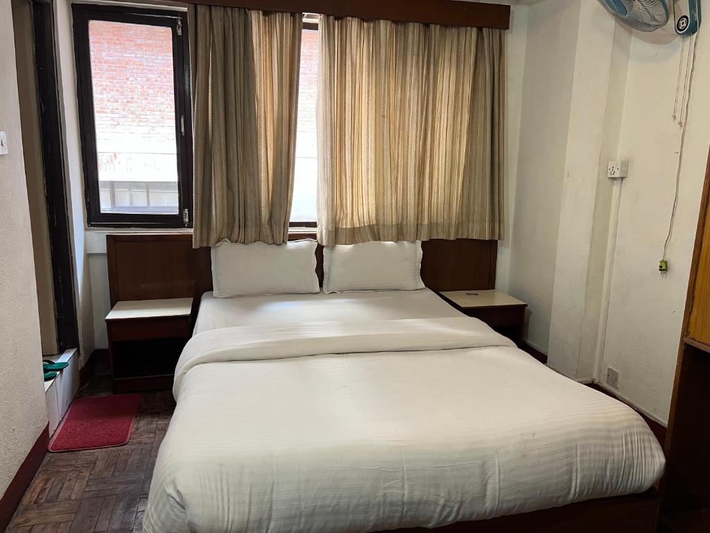 Postel nebo postele na pokoji v ubytování Hotel Earth House