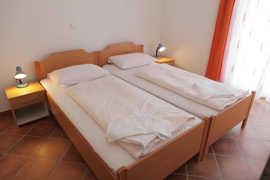 Posteľ alebo postele v izbe v ubytovaní Apartment Horizont