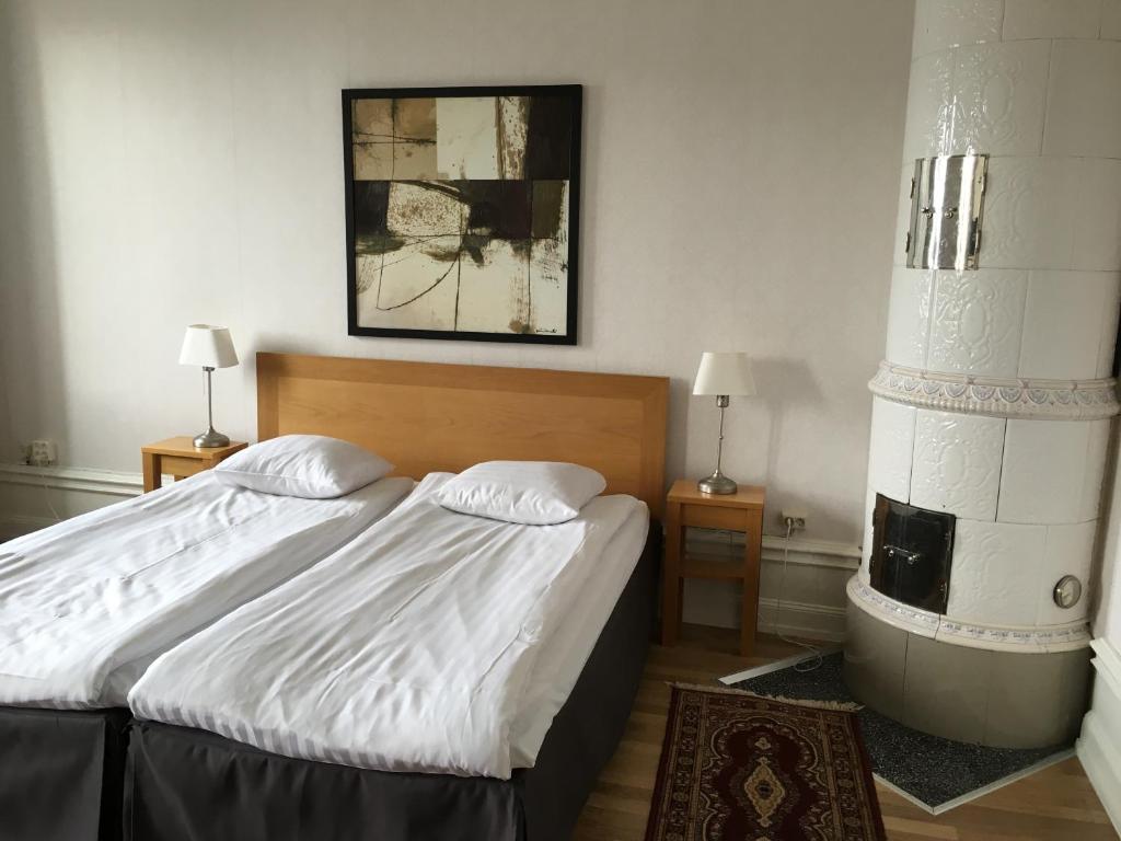 Postel nebo postele na pokoji v ubytování First Hotel City Eskilstuna