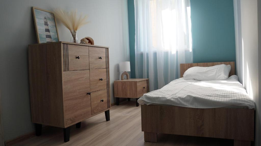 Postel nebo postele na pokoji v ubytování Jantar