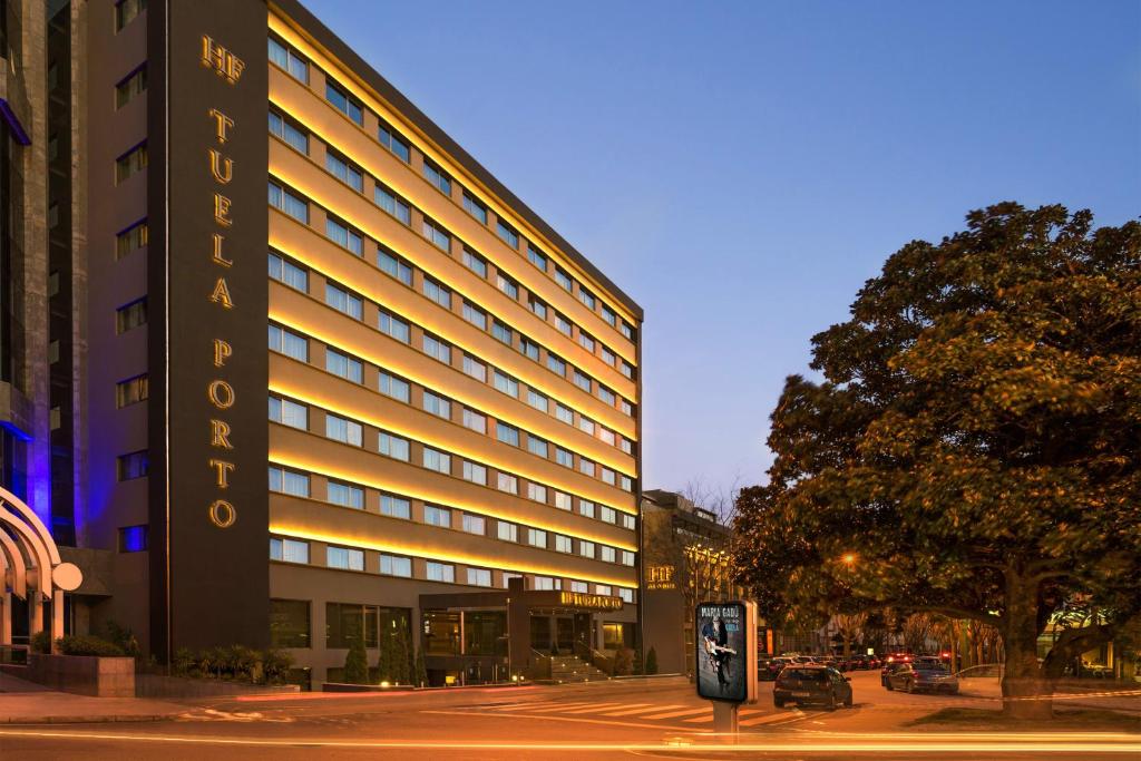 a large building with a sign on the side of it at HF Tuela Porto in Porto
