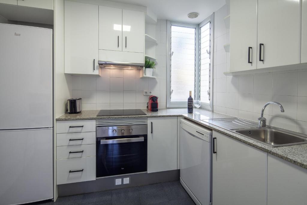 A kitchen or kitchenette at Habitat Apartments Hot Jazz