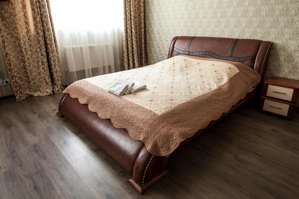 Postel nebo postele na pokoji v ubytování Chyhorinskyi Hotel