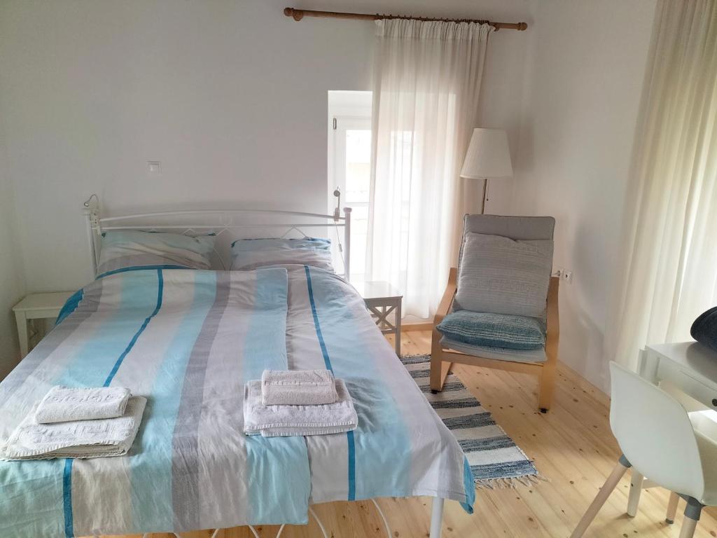 Posteľ alebo postele v izbe v ubytovaní Alexandros Traditional House