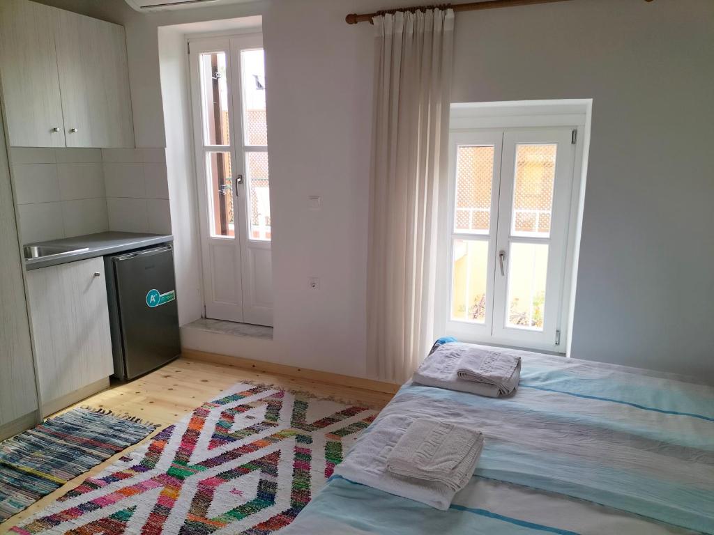 Posteľ alebo postele v izbe v ubytovaní Alexandros Traditional House