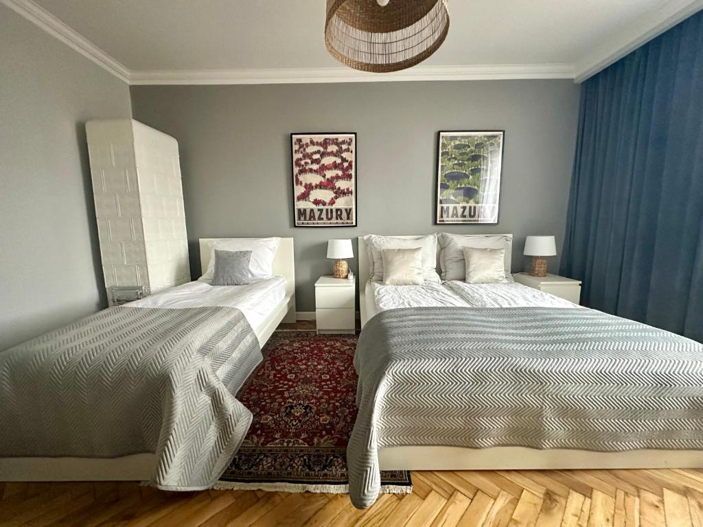 Posteľ alebo postele v izbe v ubytovaní Smile Apartments Center Kraków Old Town