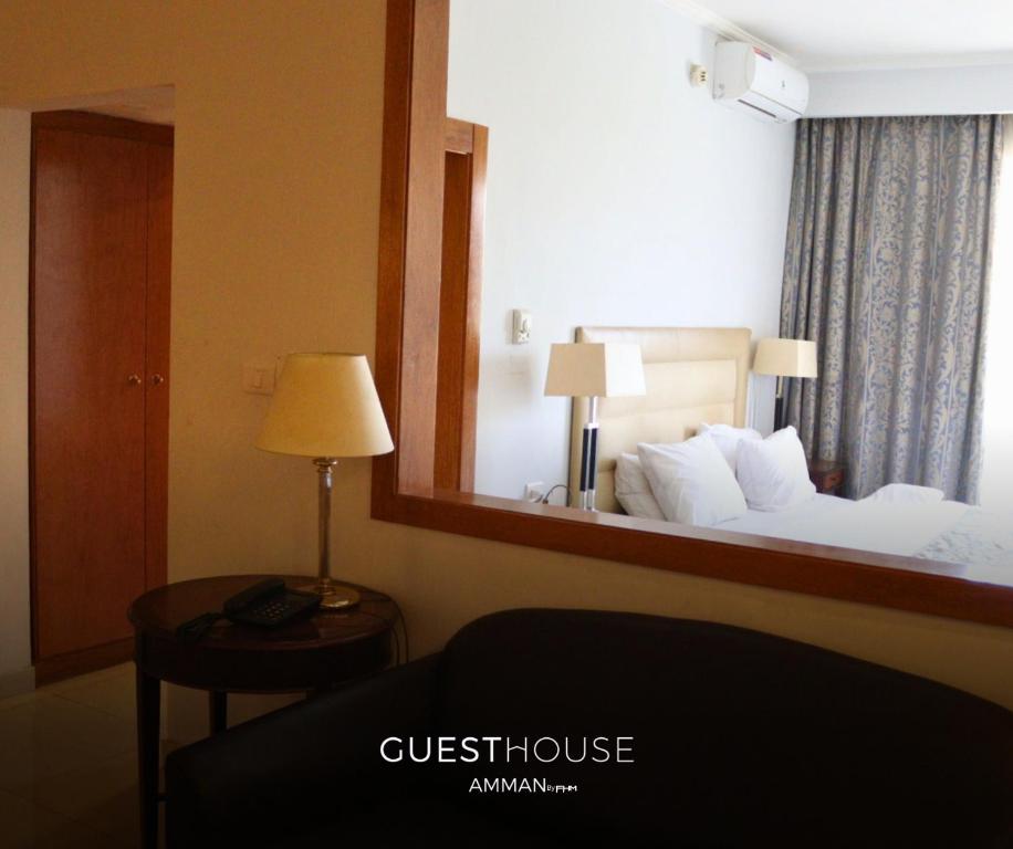 Ένα ή περισσότερα κρεβάτια σε δωμάτιο στο Guest House Hotel Amman by FHM