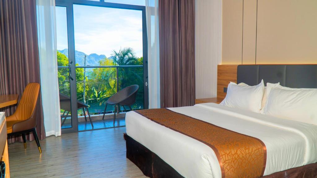 Postel nebo postele na pokoji v ubytování Vienna Hotel