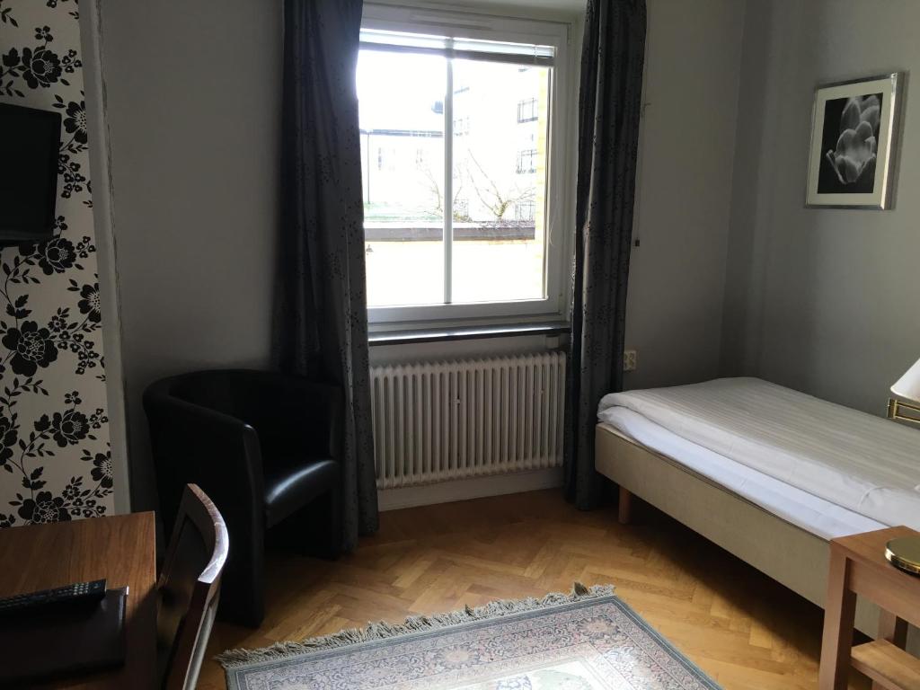 Postel nebo postele na pokoji v ubytování First Hotel City Eskilstuna
