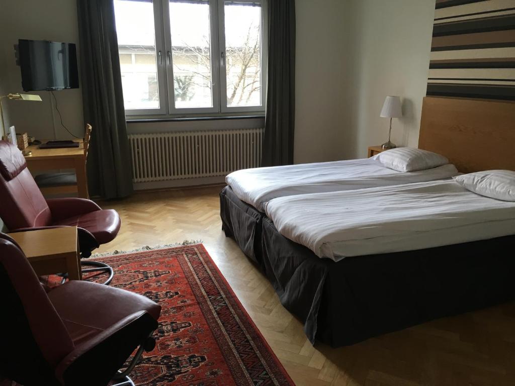 Postel nebo postele na pokoji v ubytování First Hotel City Eskilstuna