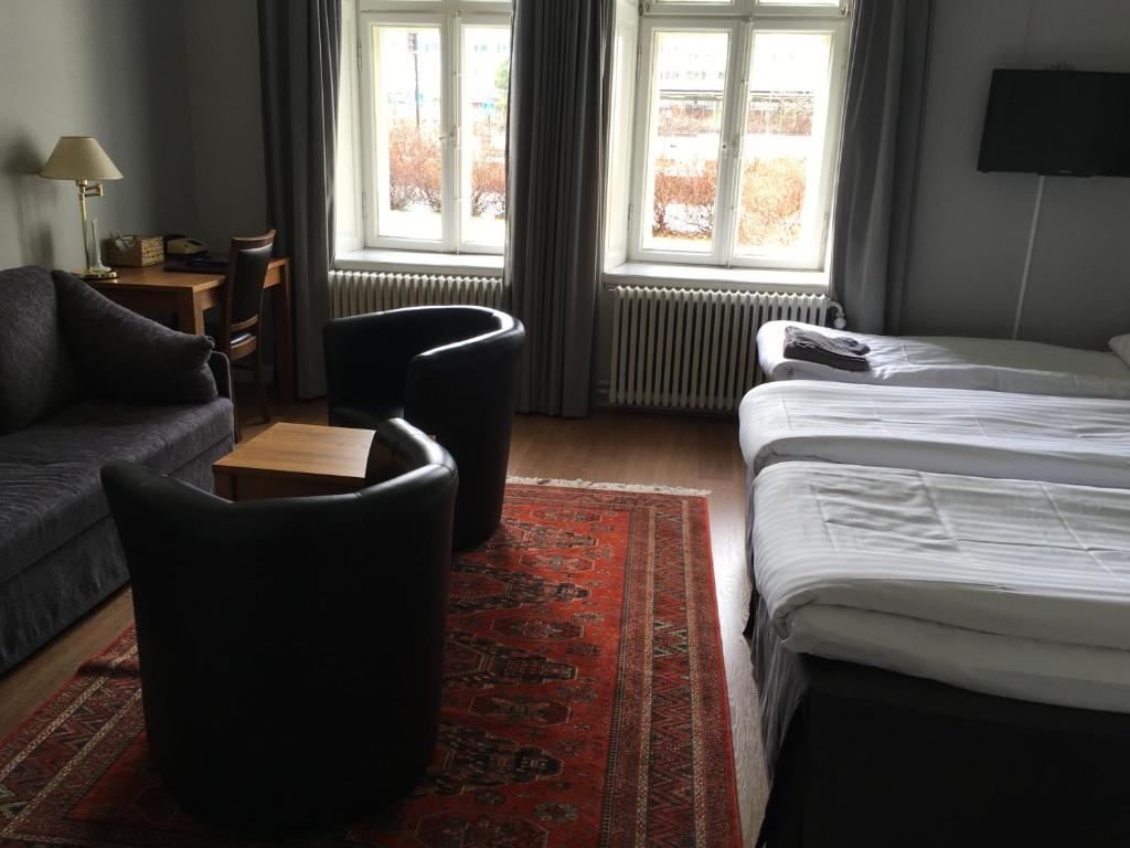 Postel nebo postele na pokoji v ubytování First Hotel City Eskilstuna