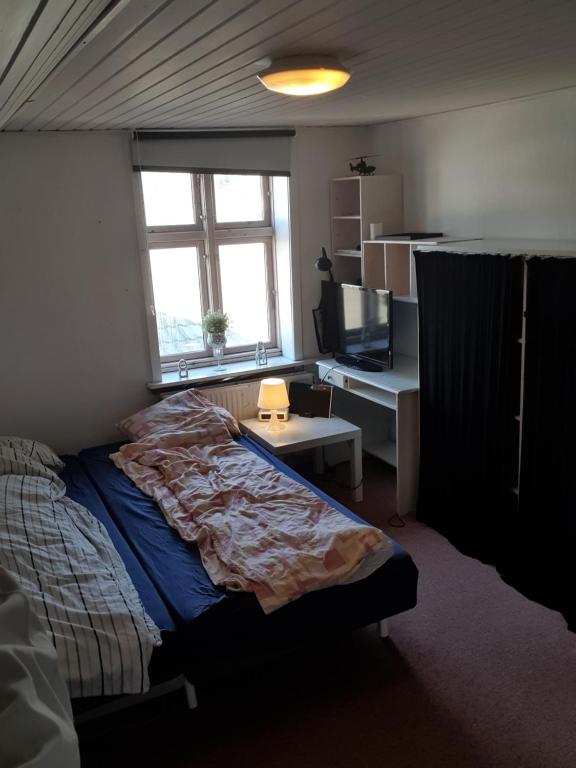 Postel nebo postele na pokoji v ubytování Rundvejen Guest House