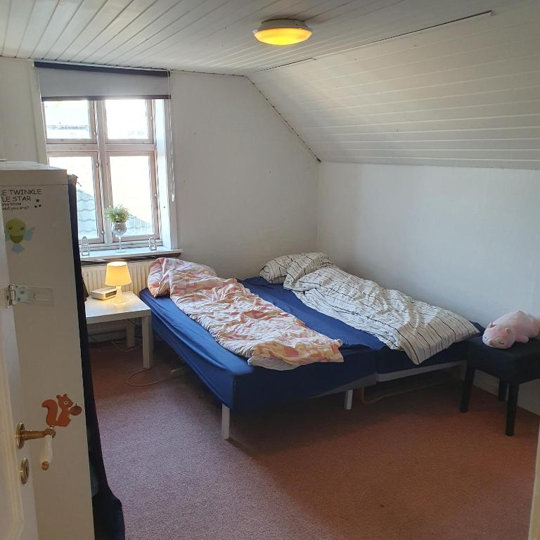 Postel nebo postele na pokoji v ubytování Rundvejen Guest House