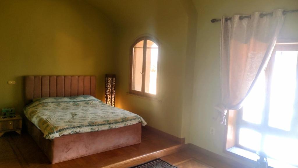 Postel nebo postele na pokoji v ubytování Alf Layla Resort