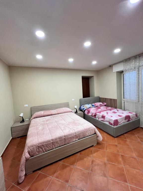 Postel nebo postele na pokoji v ubytování Appartamenti Minturnae Relais