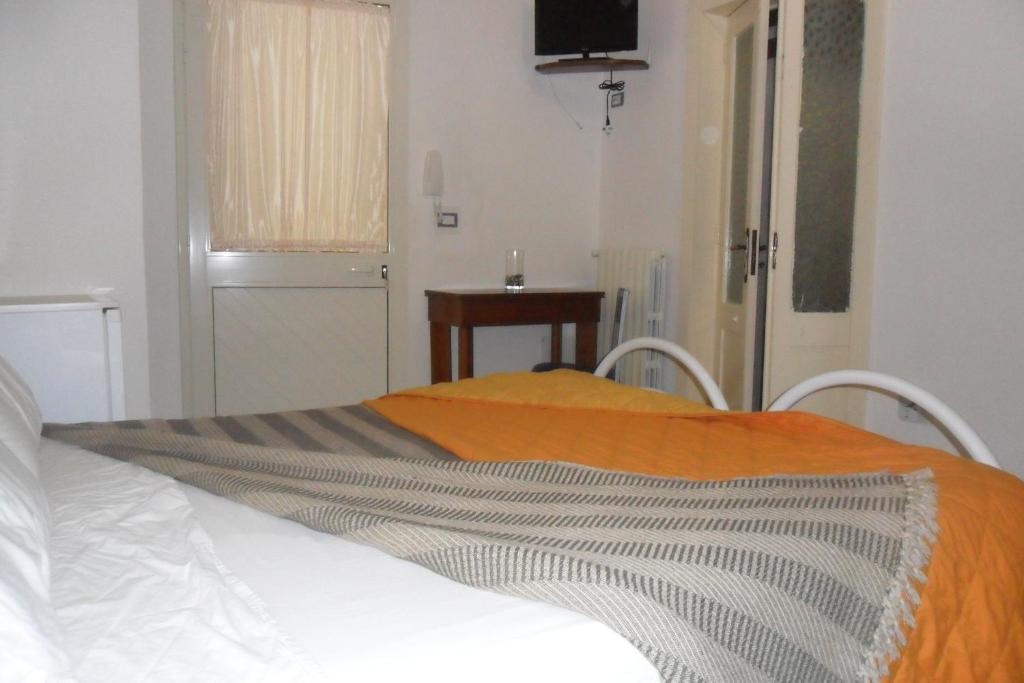 A bed or beds in a room at La Stanza Alternativa