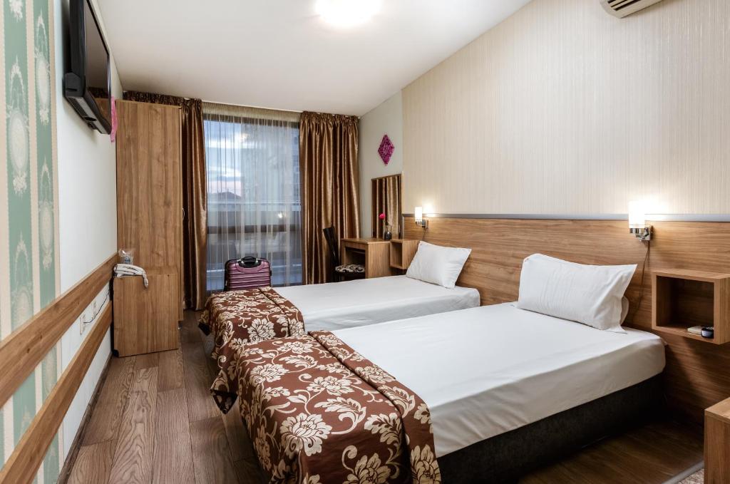 Postel nebo postele na pokoji v ubytování Hotel Gabi