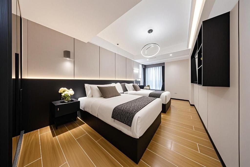 Postel nebo postele na pokoji v ubytování 颐程City View Hotel-广州太古汇珠江新城体育中心石牌桥地铁站店-广交会专享