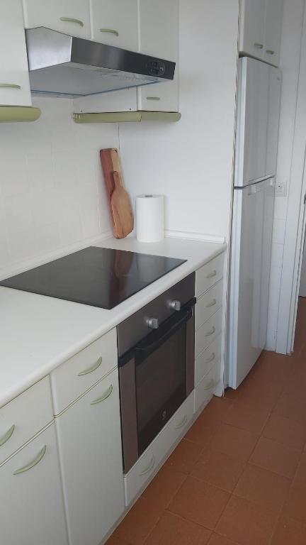 A kitchen or kitchenette at MIAMI PLAYA SIRENS en Cala Sirenas FREE WIFI