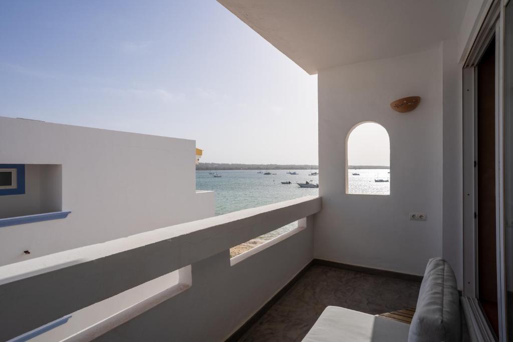 a white room with a view of the water at Formentera Especial in La Savina