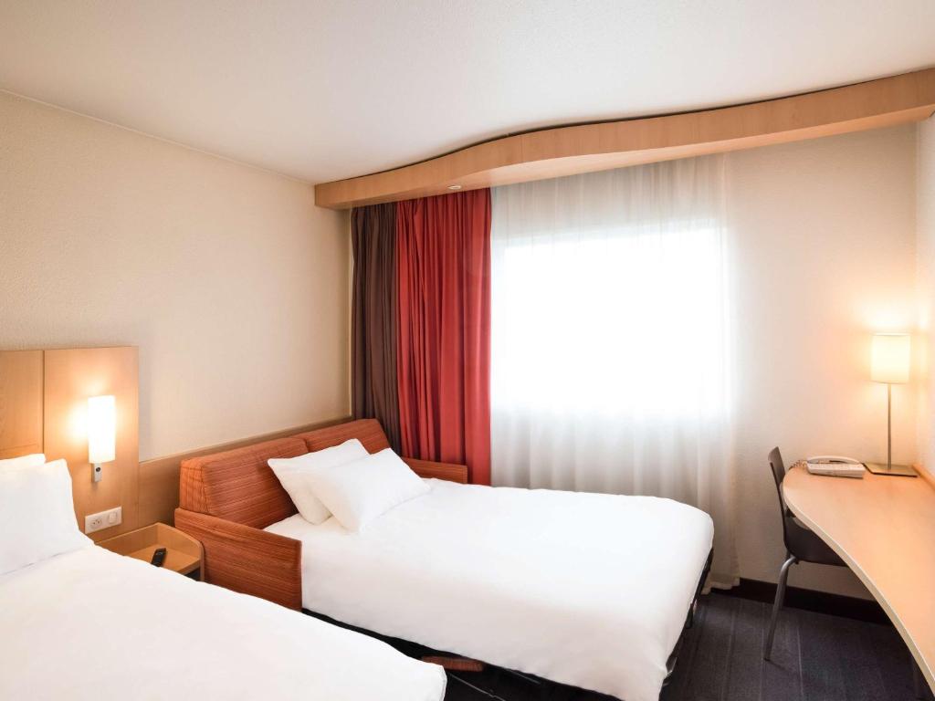 Postel nebo postele na pokoji v ubytování ibis Metz Nord