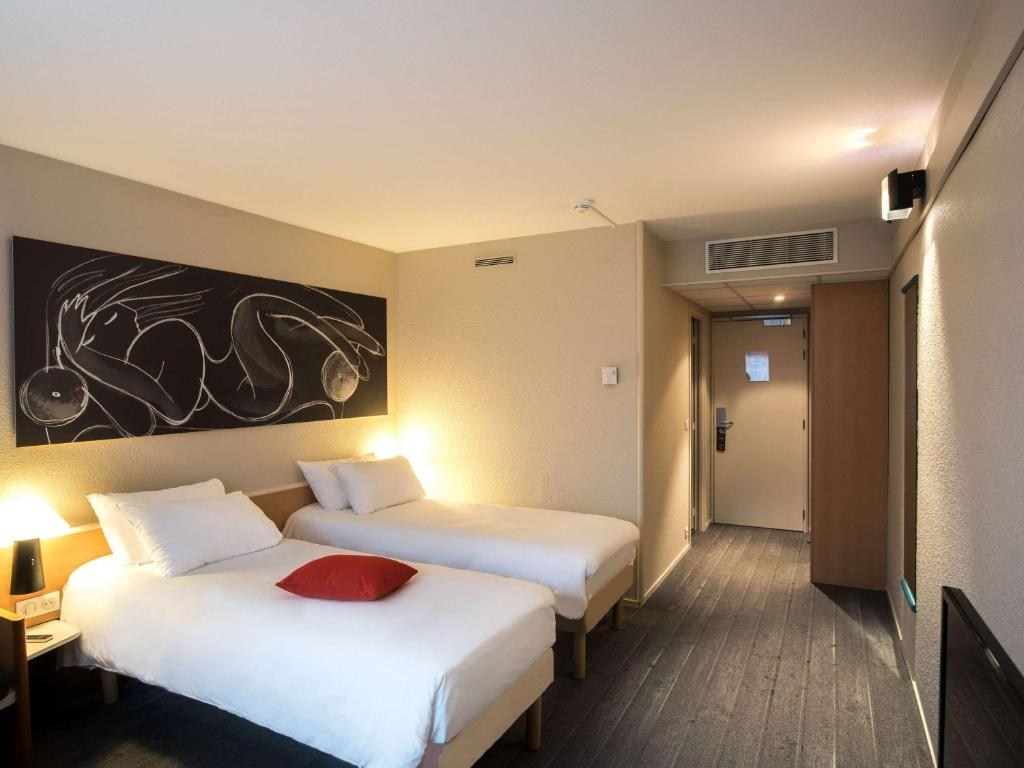 Postel nebo postele na pokoji v ubytování ibis Metz Nord