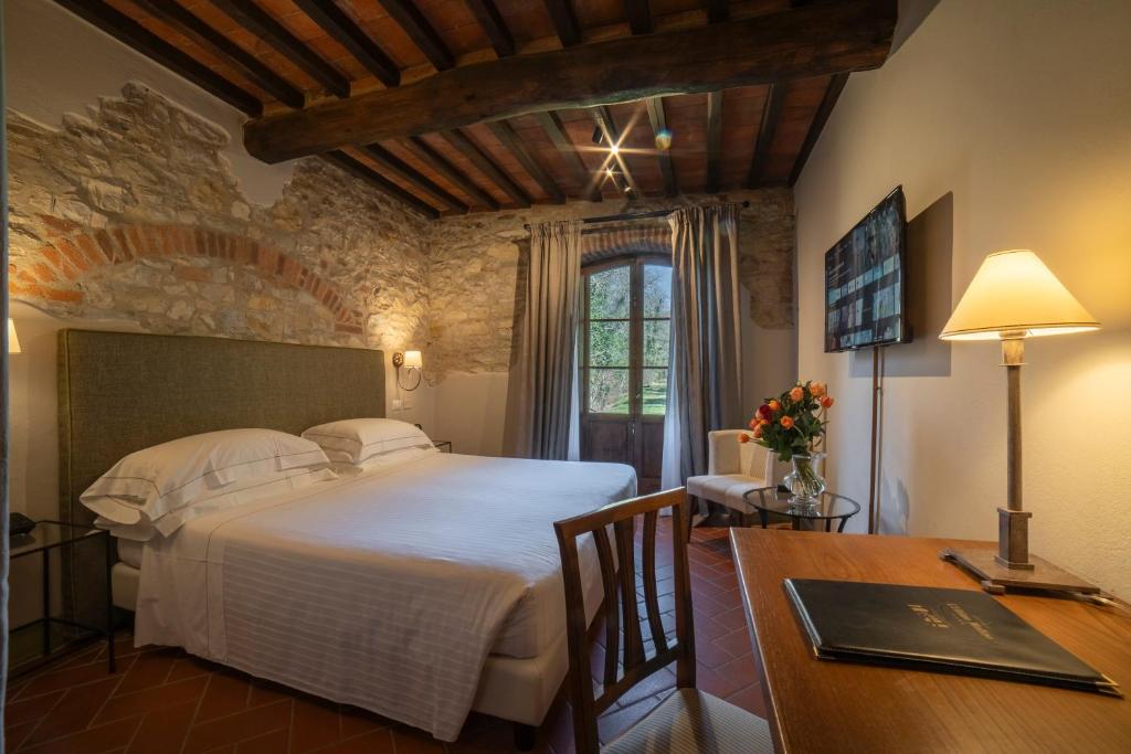Postel nebo postele na pokoji v ubytování Ultimo Mulino Country Hotel