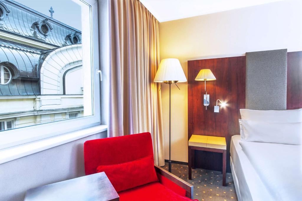 Postel nebo postele na pokoji v ubytování NH Budapest City