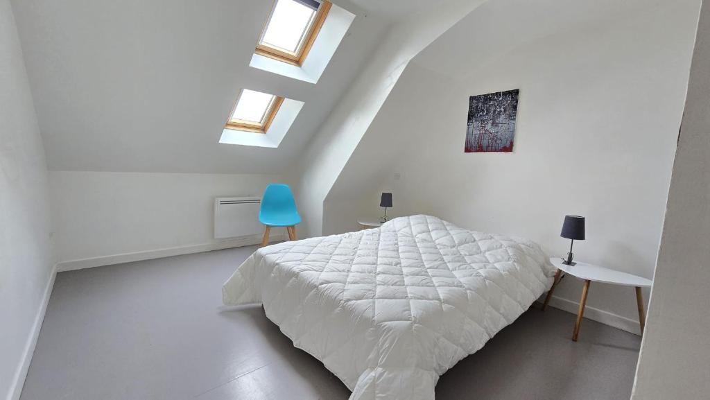 Giường trong phòng chung tại Le Voyageur A la plage vue mer