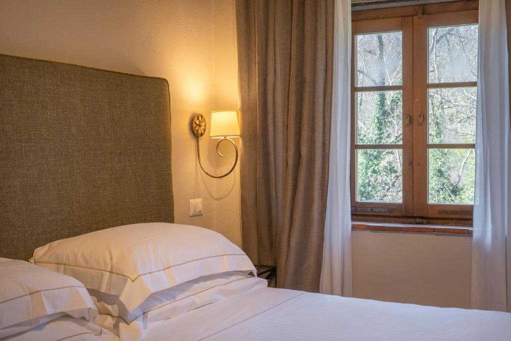 Postel nebo postele na pokoji v ubytování Ultimo Mulino Country Hotel