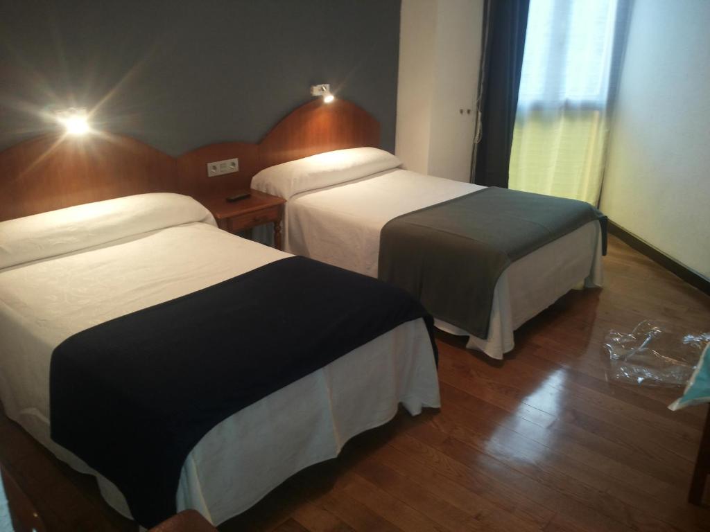 Postel nebo postele na pokoji v ubytování Hotel Urgaín
