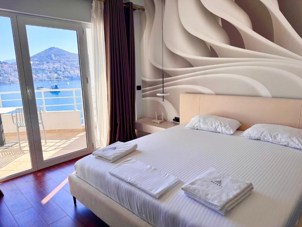Postel nebo postele na pokoji v ubytování Airstay seaview Saranda