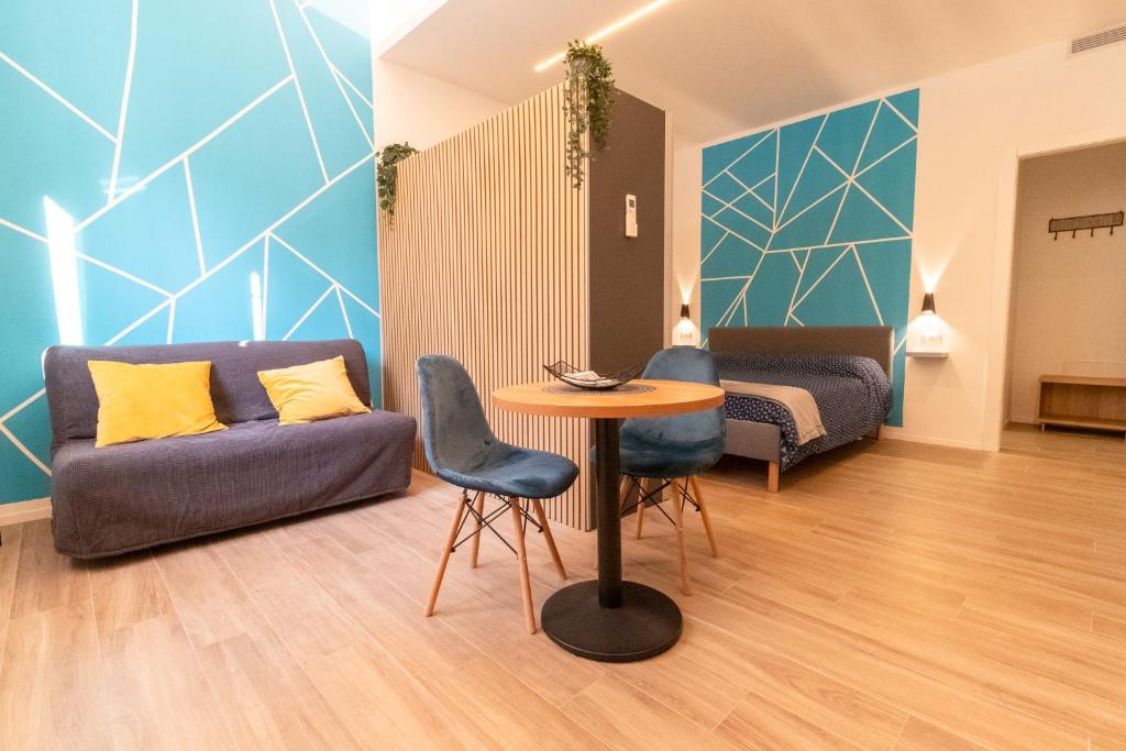 a living room with a couch and a table at Fiera house Bologna in Bologna