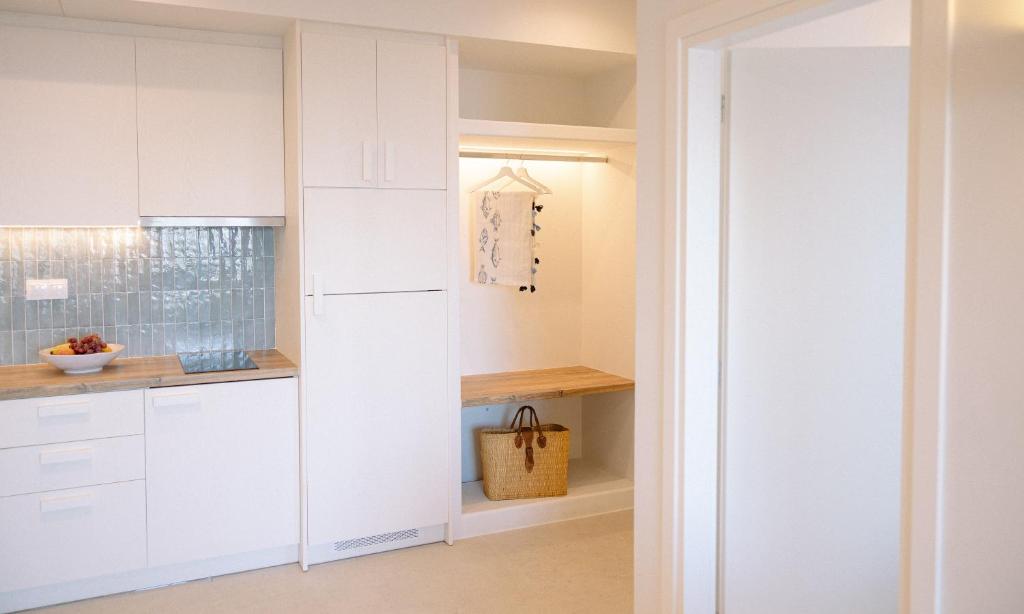 A kitchen or kitchenette at Myrto Homes Lefkada Agios Nikitas Greece