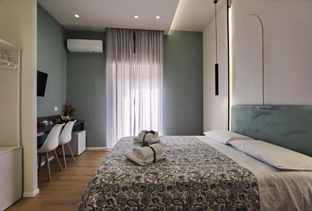 Postel nebo postele na pokoji v ubytování Tersikore bedrooms
